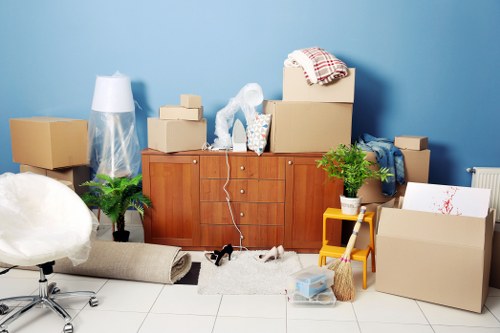Man and van helping with household moving boxes and furniture