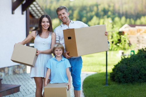 Packed boxes and furniture ready for flat removals in To