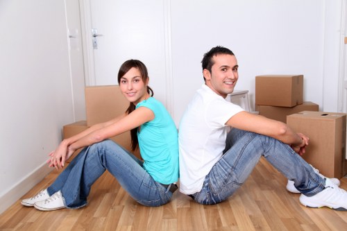 Moving team carrying boxes during a man and van job in To
