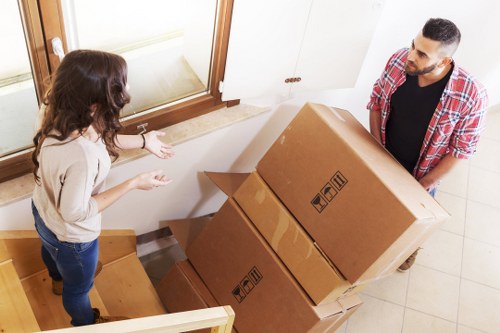 Staff communicating safety steps during a removal job