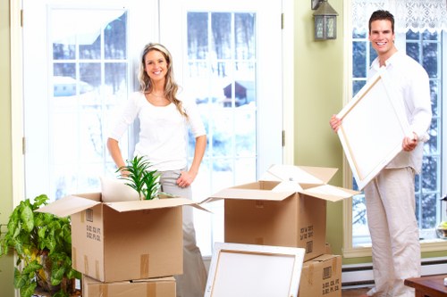 Man with van in To loading furniture and boxes